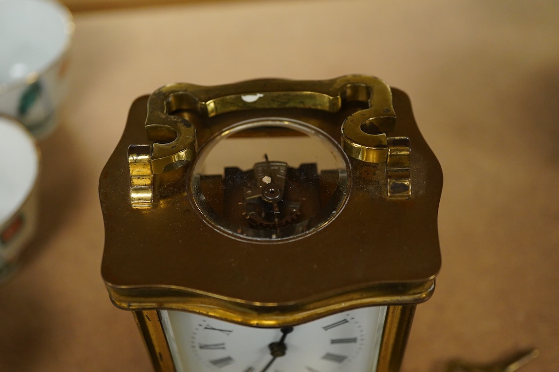 An early 20th century French gilt brass four glass carriage timepiece with key, 15cm high